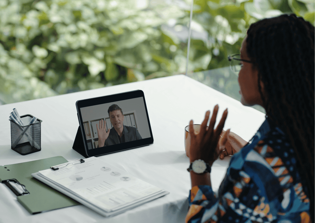 A consultant telling a story on a sales call while the prospect leans in